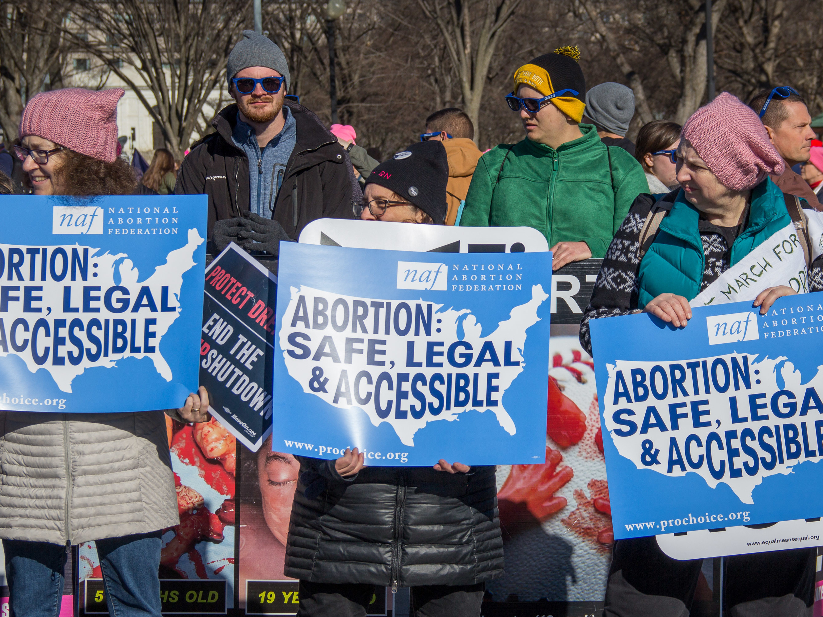 Abortion rights supporters stand in front of opponents during the Women's March on Saturday, Jan. 20 in Washington, D.C.. The march was held one day after the 45th annual March for Life. (NPR)