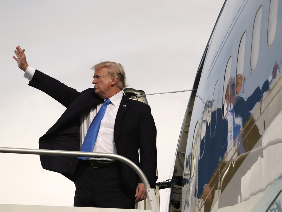 Before leaving for Davos, Switzerland, President Trump paid an impromptu call on reporters and staffers on Wednesday to say how eagerly he looks forward to talking with special counsel Robert Mueller. (Andrew Harnik/AP)