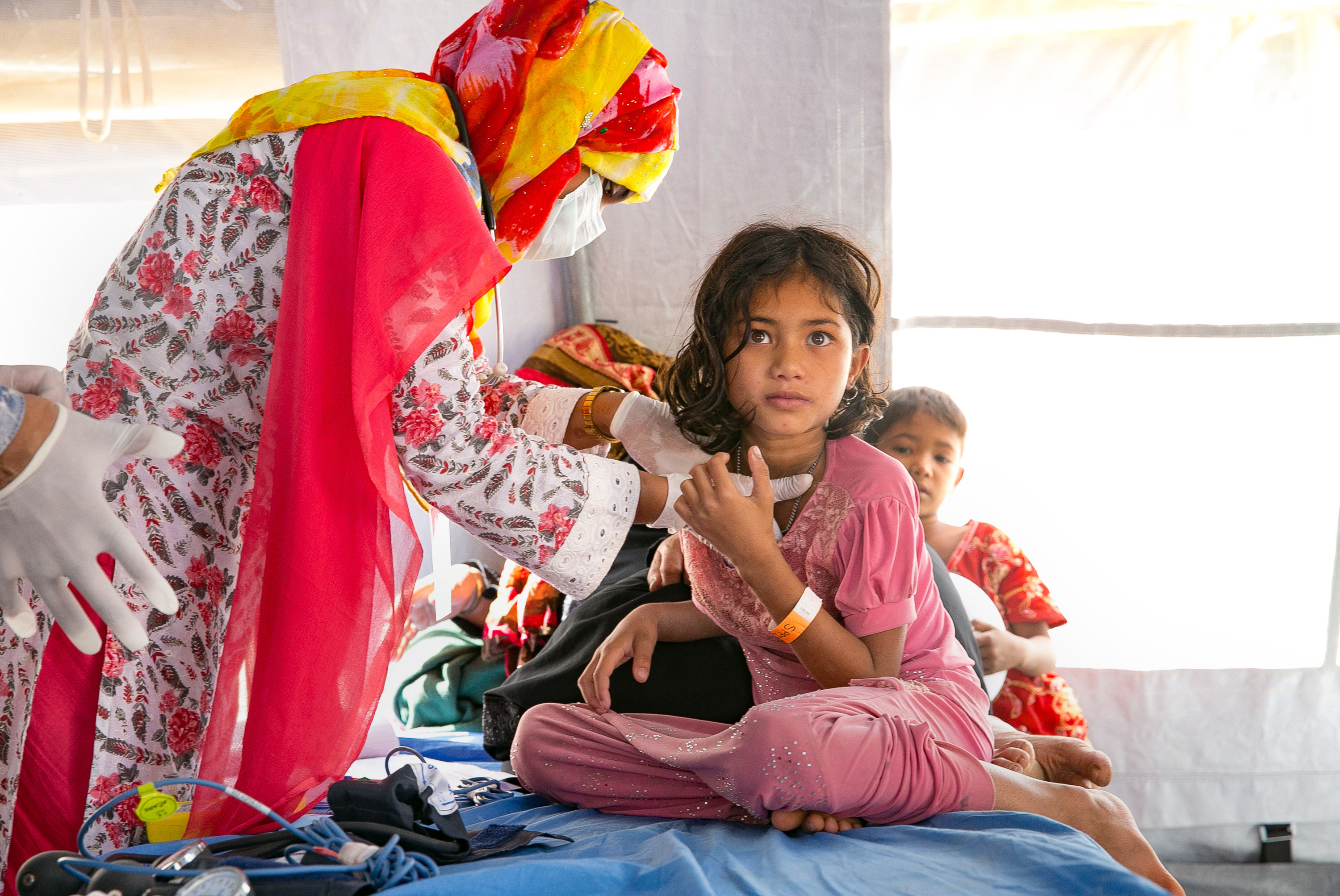Patients are treated at the Samaritan's Purse diphtheria clinic in the Balukhali Rohingya refugee camp in Chittagong district, Bangladesh. (Allison Joyce for NPR)