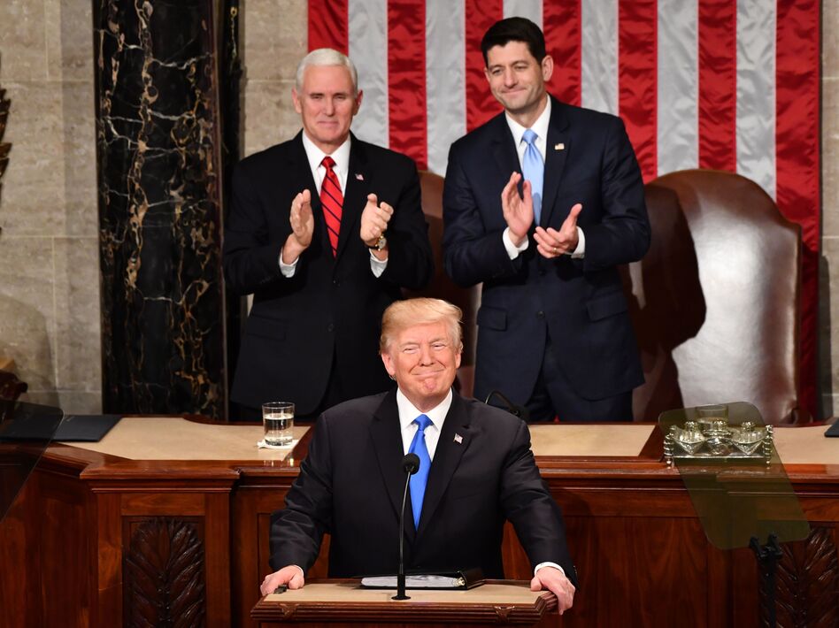 President Trump listens to applause before delivering his State of the Union address Tuesday night at the Capitol in Washington. (Nicholas Kamm/AFP/Getty Images)
