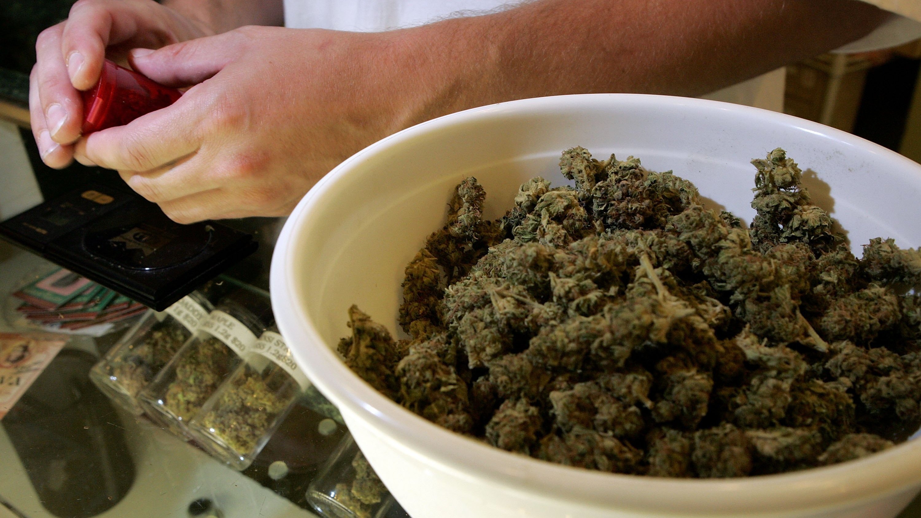 A worker packages medical marijuana in San Francisco in 2006. City prosecutors say they'll clear thousands of marijuana convictions. (Getty Images)