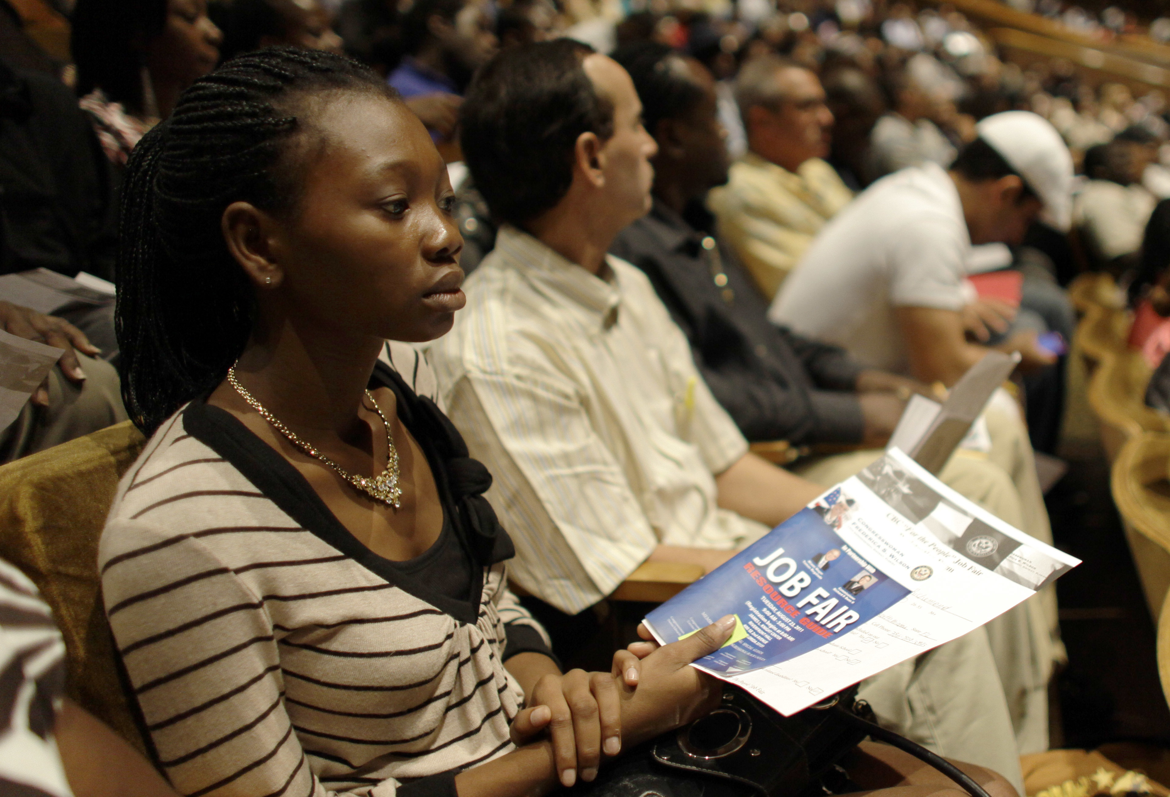 People in Miami, Fla., attend a 2011 job fair sponsored by the NAACP meant to lower the high rate of unemployment in the black community. (ASSOCIATED PRESS)