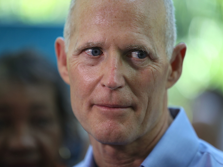 Florida Gov. Rick Scott at a news conference in May in Miami. A decision by a federal judge to strike down the state's procedure for restoring voting rights to felons who have served their time is seen as a defeat for the governor. (Joe Raedle/Getty Images)