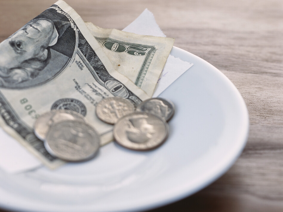Tip on Plate (Gusto Images/Getty Images)