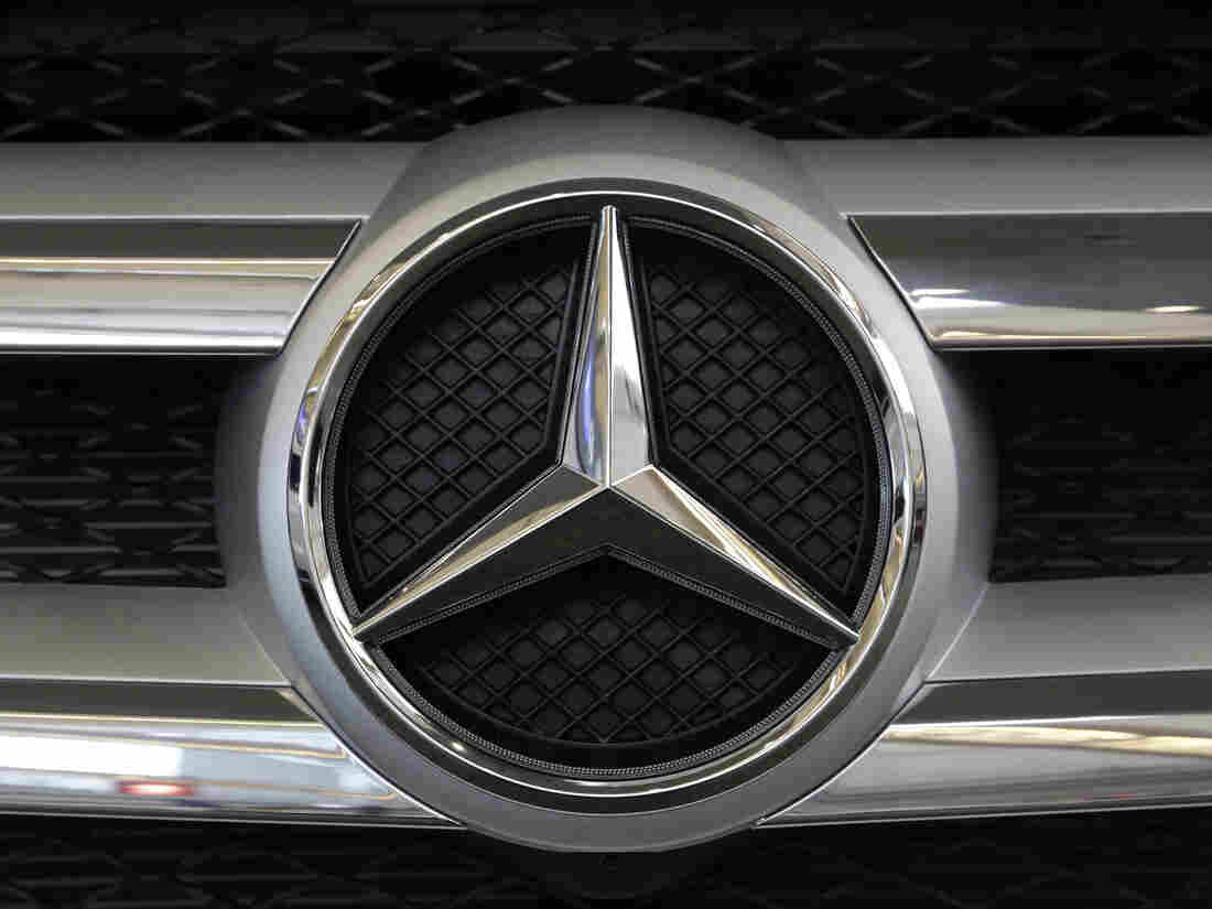 The Mercedes logo in the grille of a Mercedes 2016 GLE SUV automobile on display at the Auto Show in Pittsburgh.