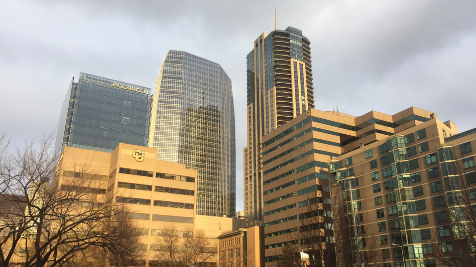 Denver's newest skyscraper (center) followed new building codes for energy efficiency. The city wants to reduce greenhouse gas emissions 80 percent by 2050. (Dan Boyce for NPR)