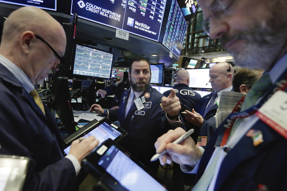 The stock market swung dramatically Wednesday, ending about where it started the day â after record losses earlier in the week. (Richard Drew/AP)