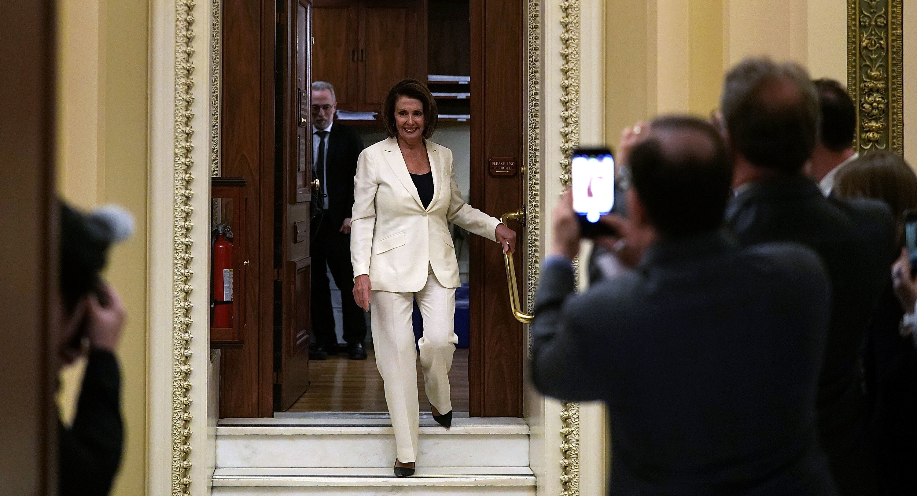 House Minority Leader Nancy Pelosi, D-Calif., leaves the House chamber after her eight-hour-long speech about immigration on Wednesday. (Getty Images)
