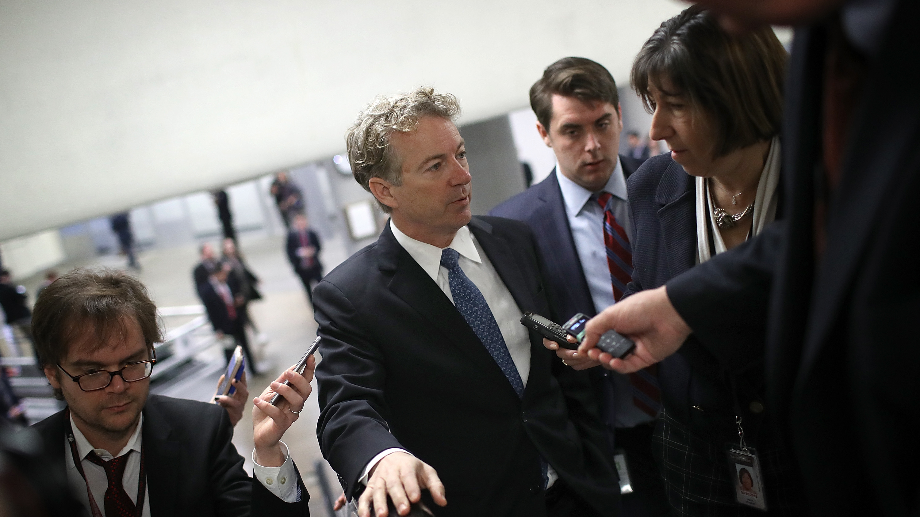 Sen. Rand Paul, R-Ky., speaks with reporters Thursday on his way to a vote on the Senate floor. (Getty Images)
