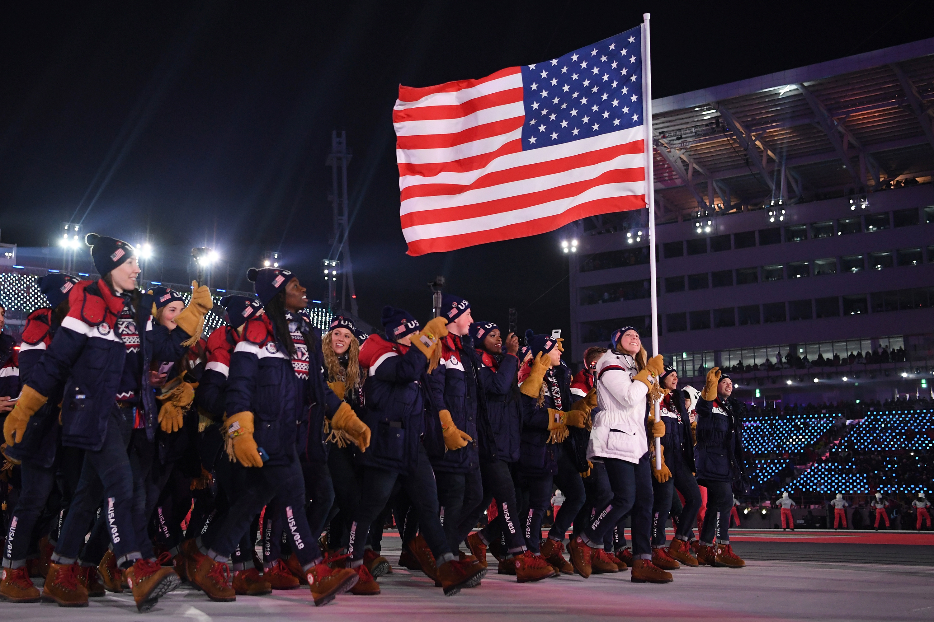 The United States team walks in the Parade of Athletes during the Winter Olympics opening ceremony on Friday. The team has more athletes than any nation at the Games and it's the most diverse of any U.S. winter squad, in terms of both race and gender. There are 108 women on the team, more than any other U.S. Winter Olympics team in the past. (Getty Images)