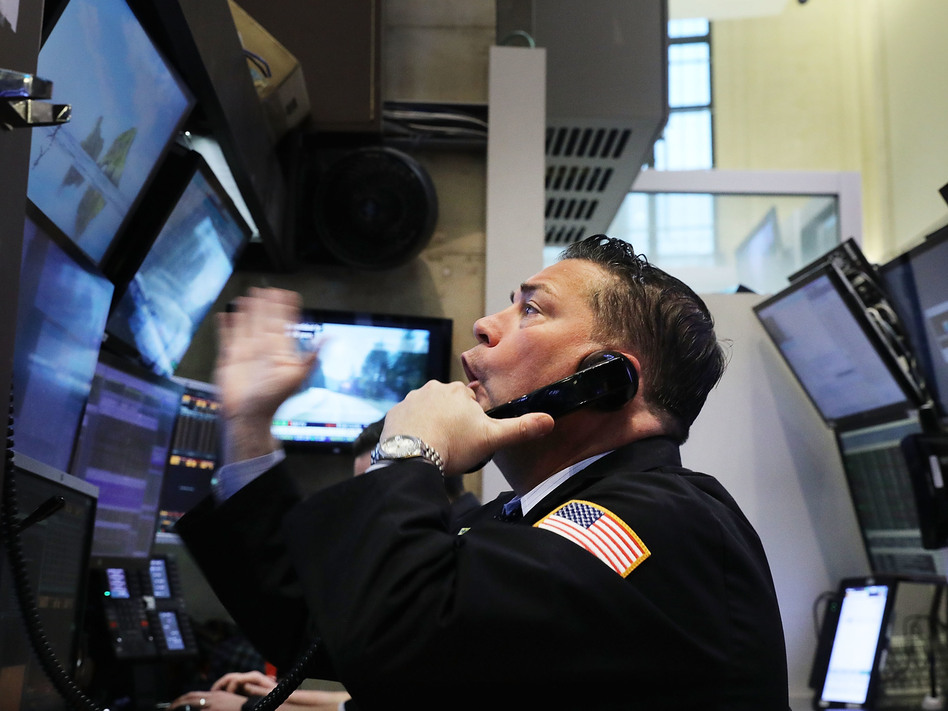 It's been a volatile week on the floor of the New York Stock Exchange, and Friday was no exception. (Spencer Platt/Getty Images)