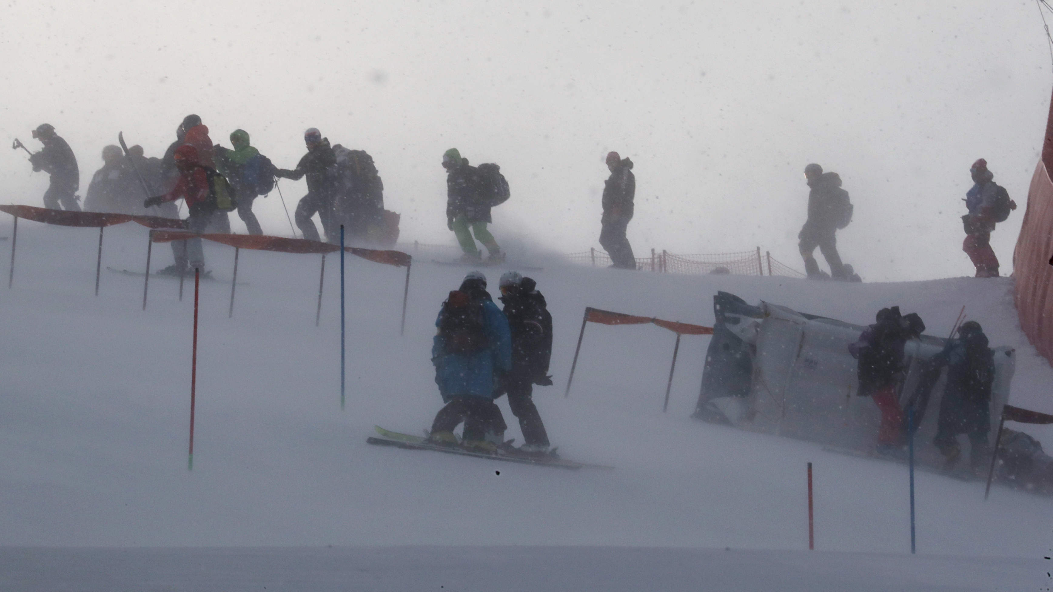 Windy conditions at the Yongpyong Alpine Center forced the delay of the women's slalom race. Here, team members and coaches are seen on the mountain as gusts of wind blew Wednesday morning. (Reuters)