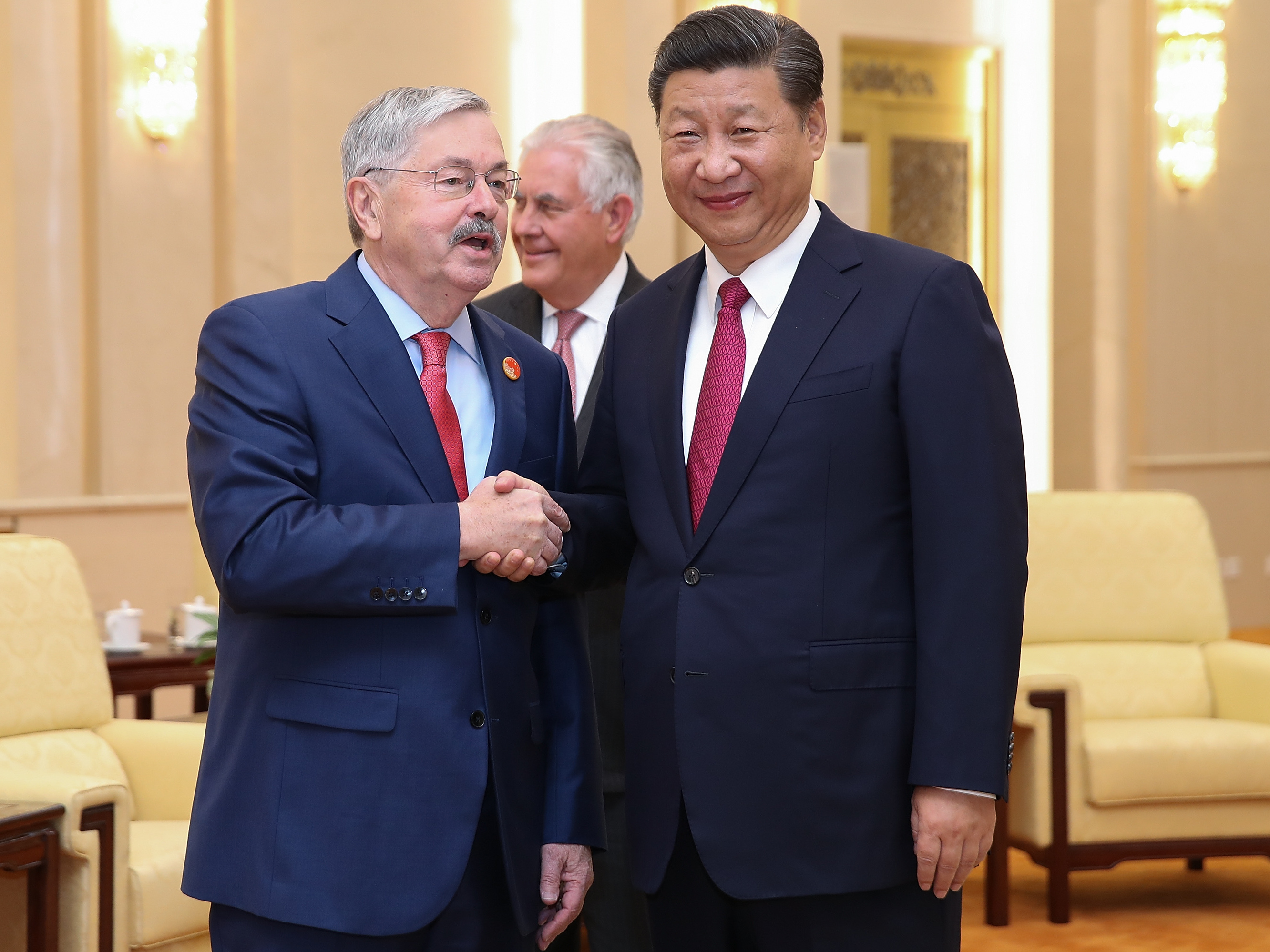 U.S. Ambassador Terry Branstad shakes hands with Chinese President Xi Jinping at the Great Hall of the People on Sept. 30 in Beijing, China. (Getty Images)