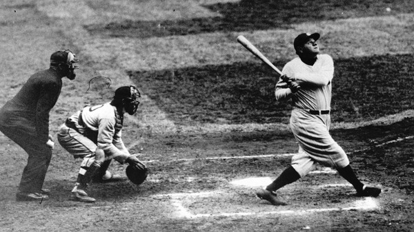 Babe Ruth clouts a towering home run during his time with the New York Yankees.