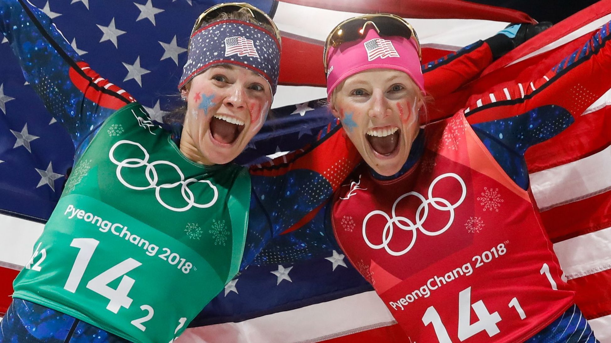 Jessica Diggins, left, and Kikkan Randall celebrate winning their gold medal in the women