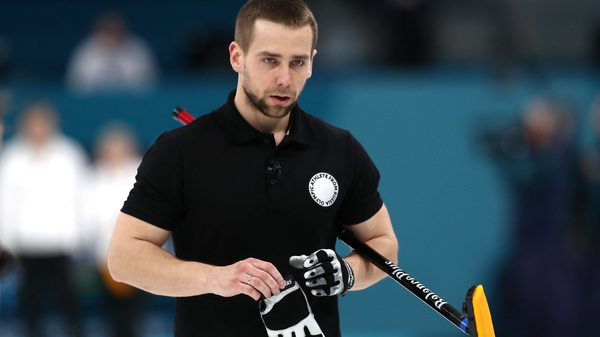 Aleksandr Krushelnitckii, seen during the bronze medal game against Norway last week. The Olympian from Russia won that mixed doubles bronze — but had the medal stripped Thursday for testing positive for a banned substance.