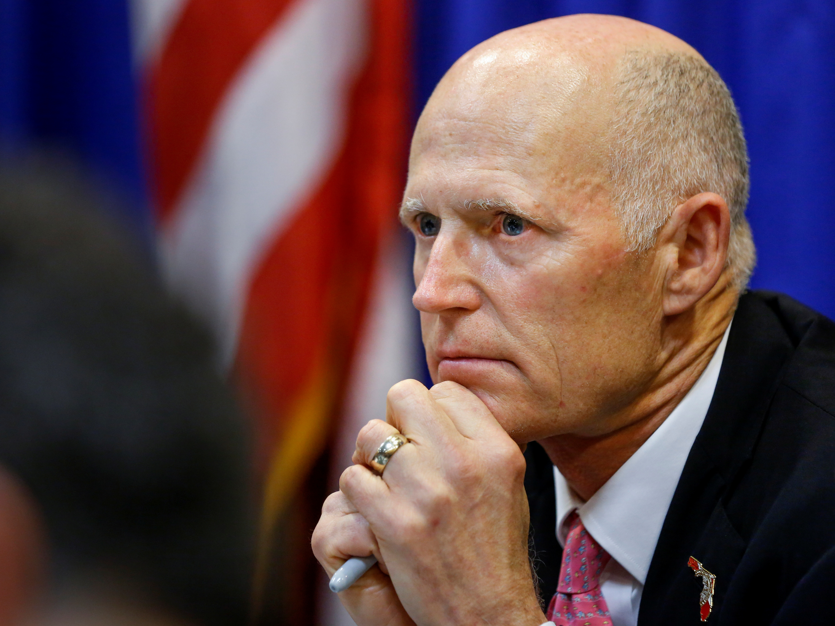 Florida Gov. Rick Scott wants a range of measures aimed at preventing shootings like the one last week at a high school in Parkland, Fla. Scott is seen here during a meeting with law enforcement, mental health and education officials on Tuesday. (Reuters)