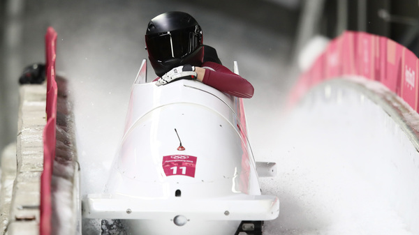 Nadezhda Sergeeva and Anastasia Kocherzhova, competing as Olympic Athletes from Russia, react in the finish area during the women