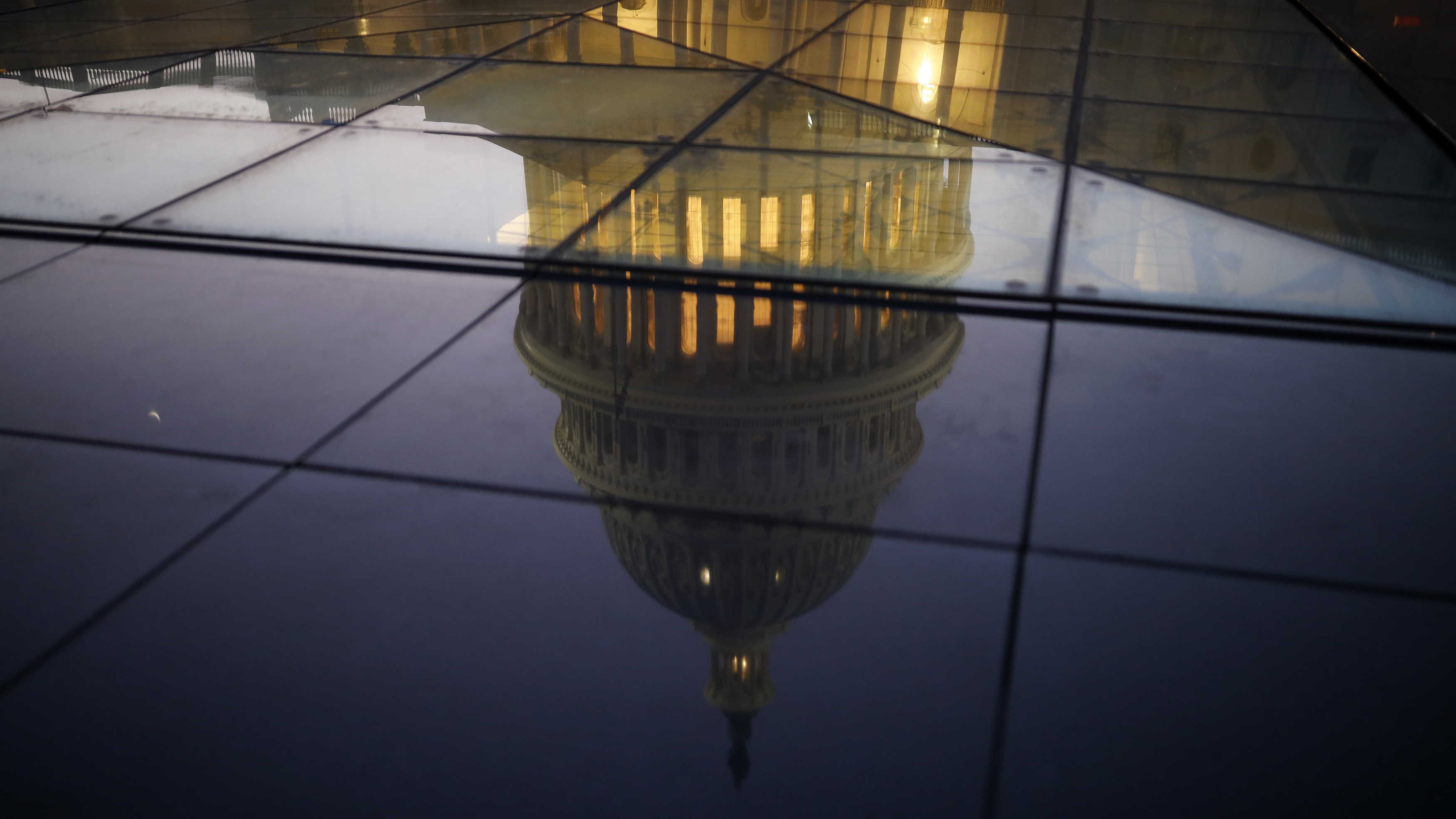 The U.S. Capitol is seen reflected in the windows of the Capitol Visitors Center. As Democrats seek to win the House in this year's midterms, they're relying on an online fundraising platform called ActBlue. (Getty Images)