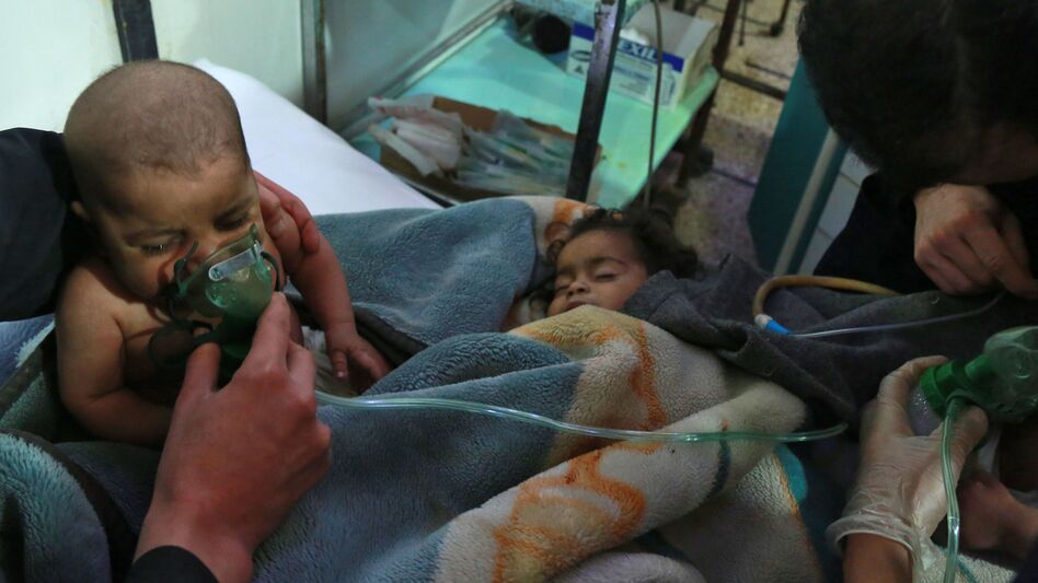 Syrian children receive treatment at a makeshift clinic after a suspected chemical attack on the rebel-held village of al-Shifuniyah, in the Eastern Ghouta region on the outskirts of the capital Damascus, late on Sunday. A child died and at least 13 other people suffered breathing difficulties after an attack on the besieged Syrian rebel enclave, a medic and a monitor said. (Hamza Al-Ajweh/AFP/Getty Images)