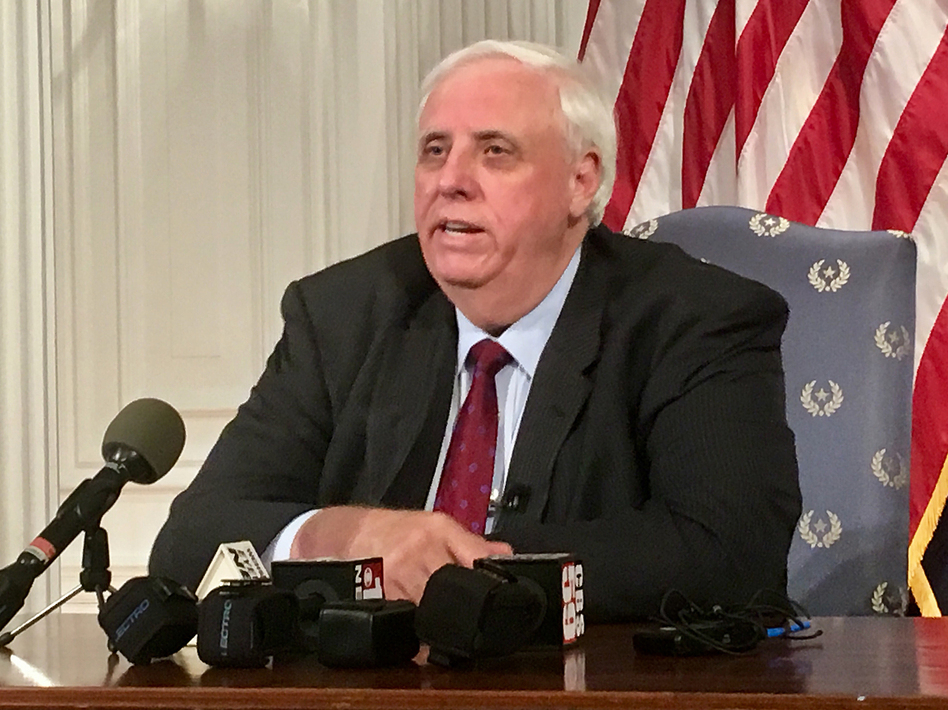 West Virginia Gov. Jim Justice announces on Tuesday that teachers would return to work on Thursday and that he's offering teachers and school service personnel a pay raise. (John Raby/AP)