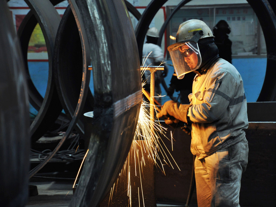 A worker cuts steel in Qingdao in China's eastern Shandong province. President Trump said Thursday that he plans to impose tariffs on U.S. imports of steel and aluminum. (AFP/Getty Images)