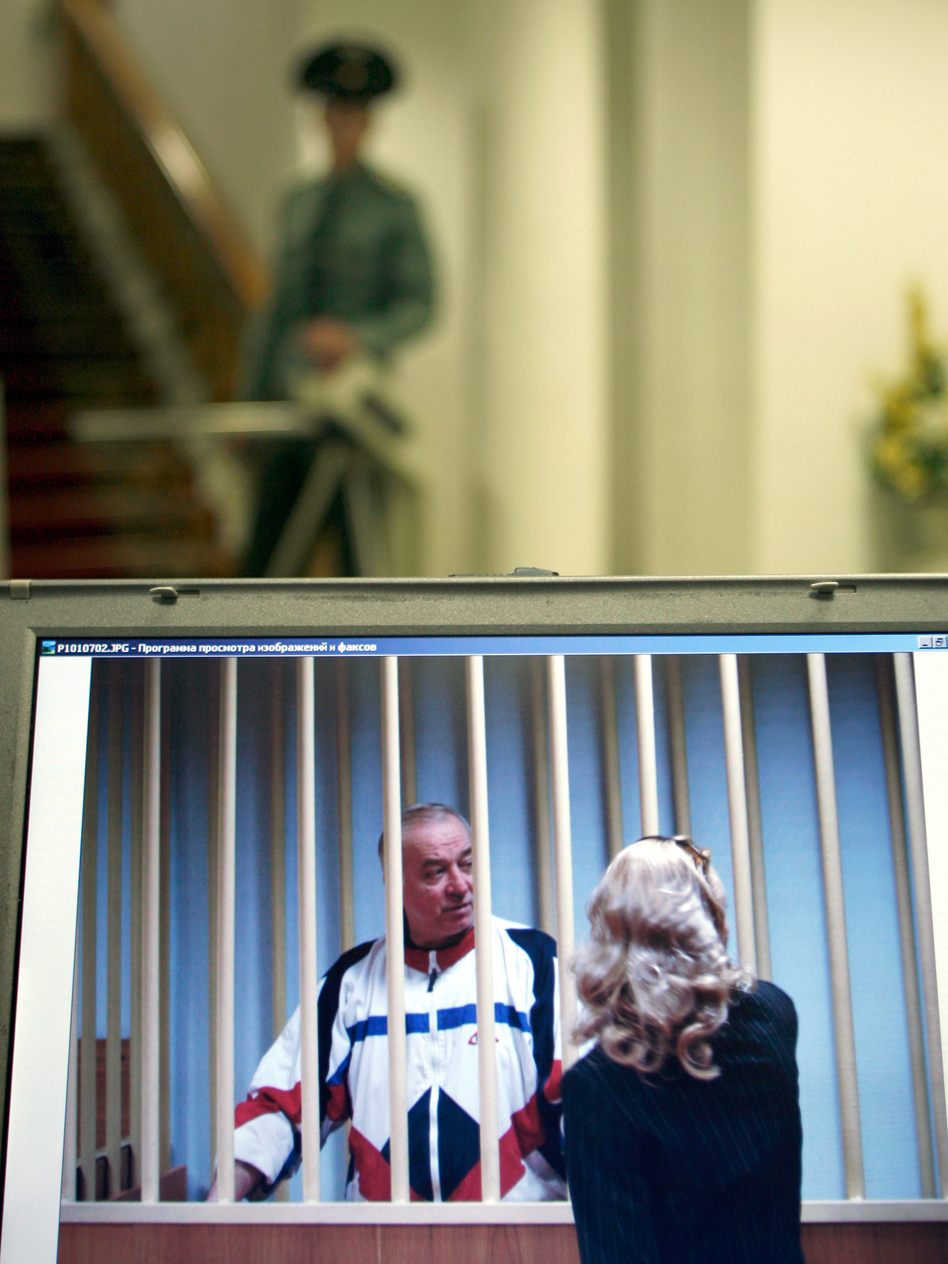 A monitor outside a courtroom shows Sergei Skripal speaking to his lawyer from behind bars in Moscow in 2006. Skripal is a retired Russian colonel recruited by British intelligence in the mid-1990s. (Misha Japaridze/AP)