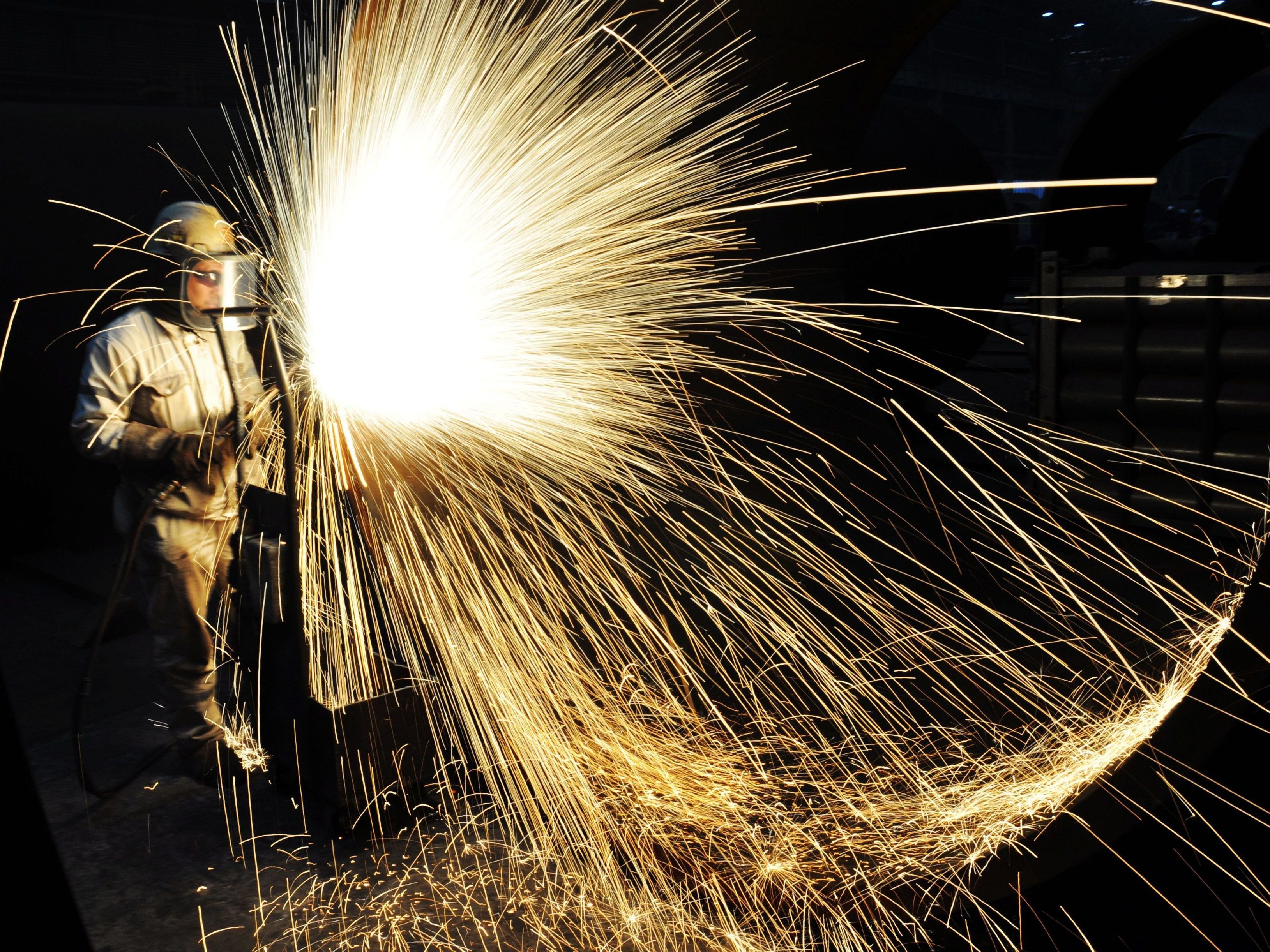 China has built one of the world's most formidable steel-producing sectors over the years. Above, a Chinese worker cuts steel in Qingdao in eastern Shandong province in January. (AFP/Getty Images)