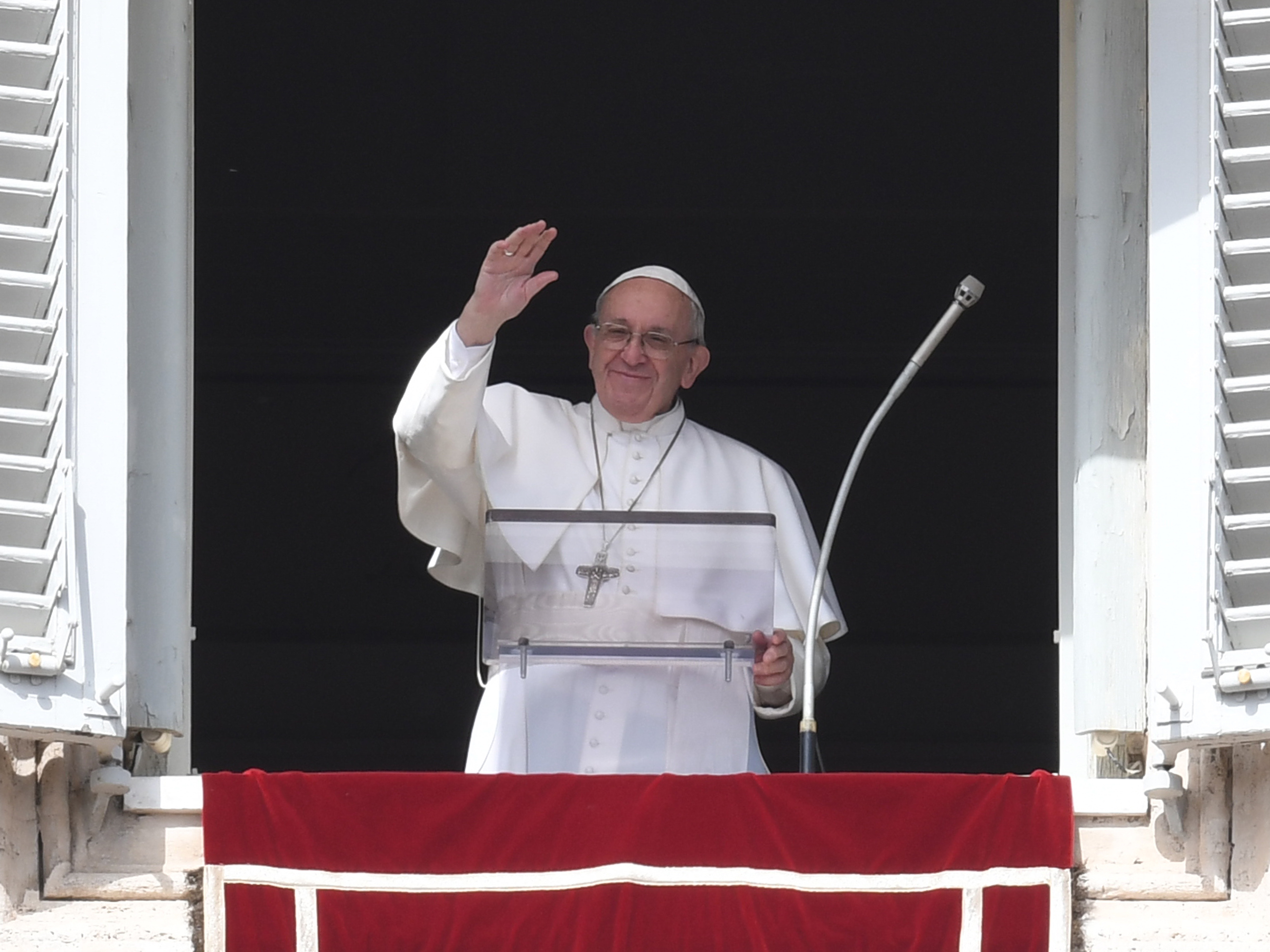 Pope Francis waves to the crowd in St. Peter's Square on Sunday. Recent months have seen Francis become the target of criticism on various fronts, and his image as a charismatic reformer has suffered some hits. (AFP/Getty Images)