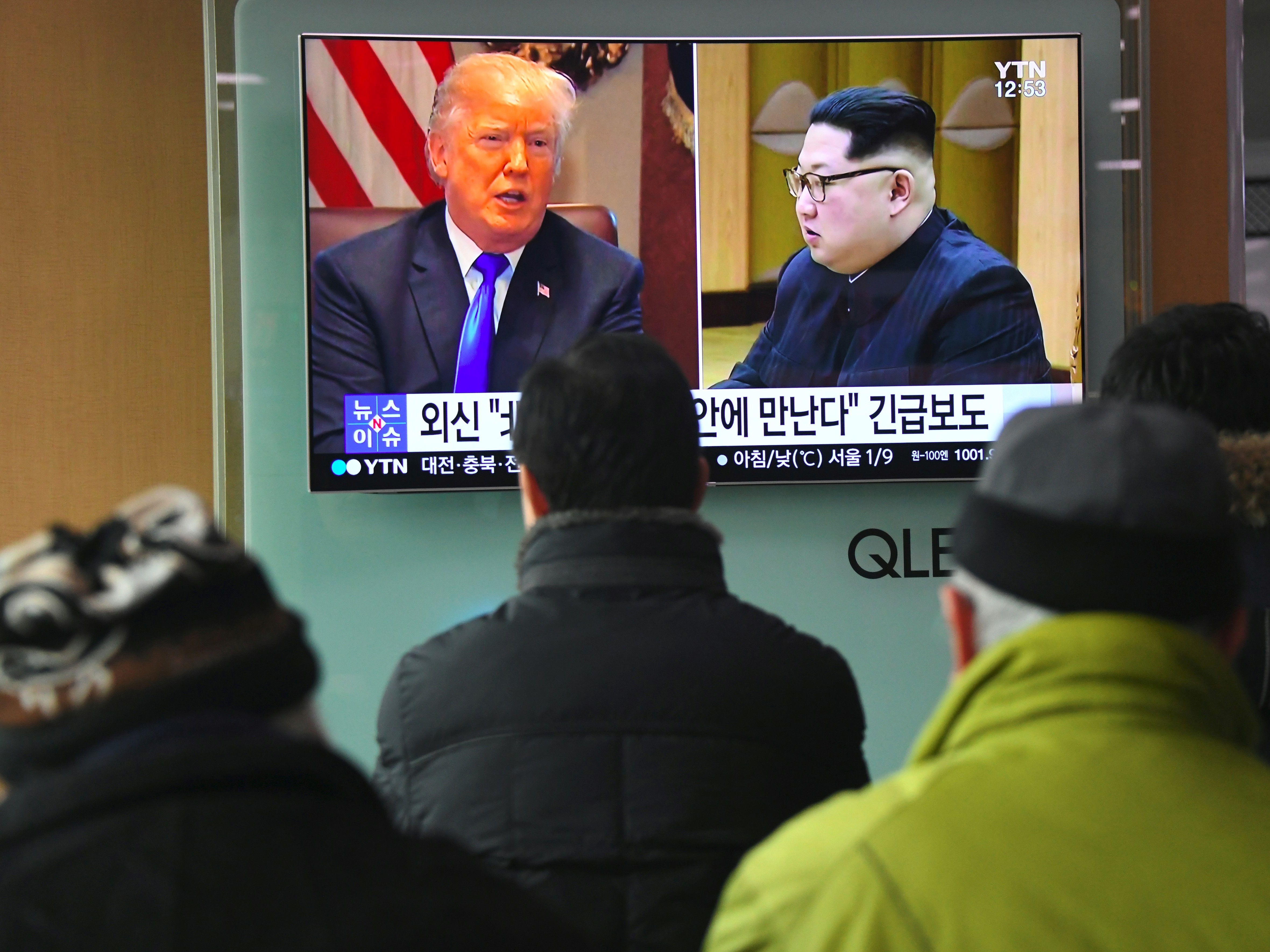 South Koreans at a railway station in Seoul watch a news report showing President Trump and North Korean leader Kim Jong Un on March 9. Trump agreed the day before to a historic first meeting with Kim. (AFP/Getty Images)