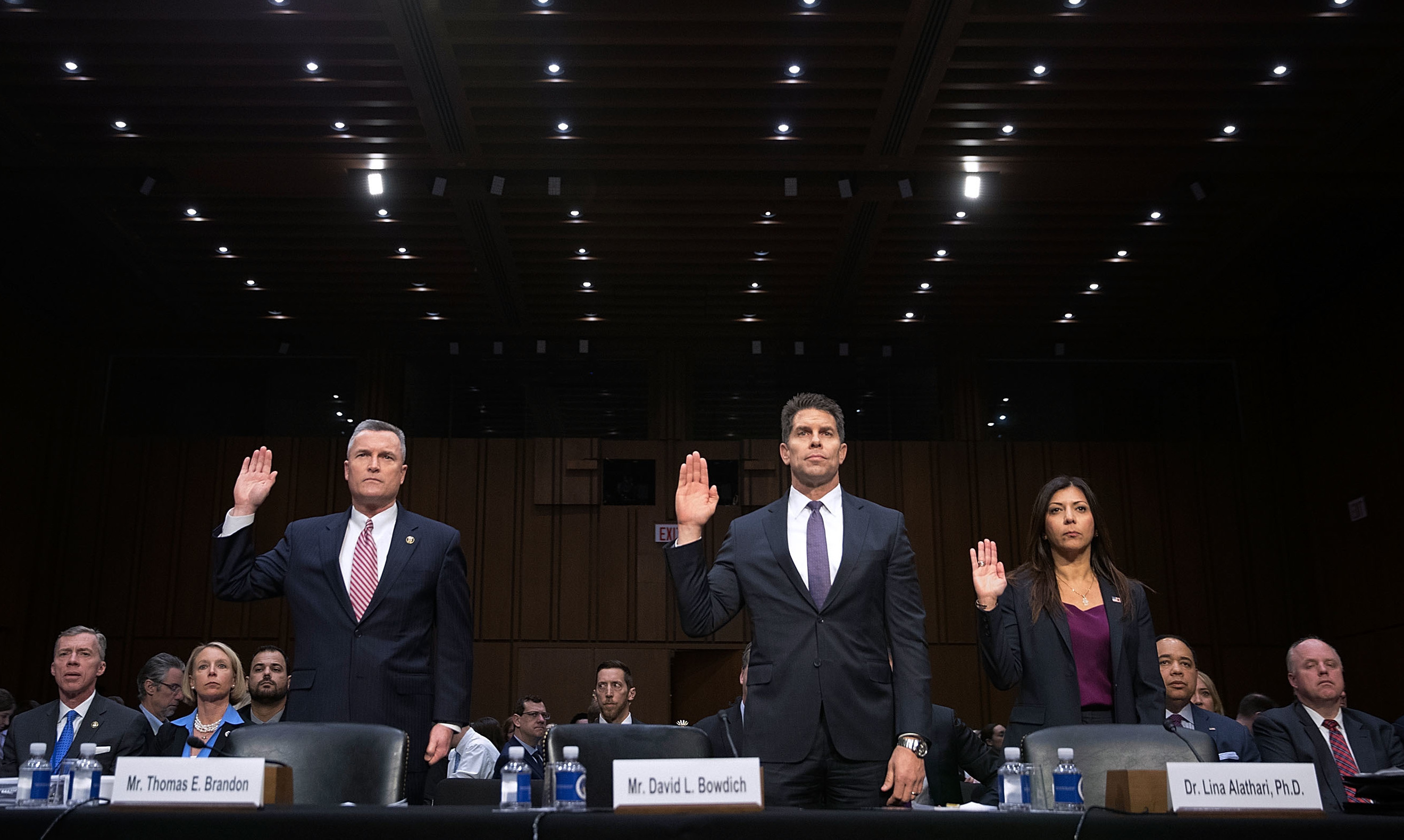 Acting Director of the Bureau of Alcohol, Tobacco, Firearms and Explosives Thomas Brandon (from left), Acting Deputy FBI Director David Bowdich and U.S. Secret Service's National Threat Assessment Center head Lina Alathari are sworn in before testifying to the Senate Judiciary Committee on Wednesday. (Getty Images)