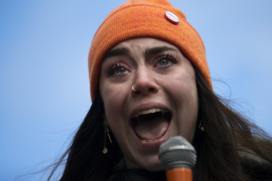 Scout Smissen, a 17-year-old junior at Roosevelt High School becomes emotional while speaking to a crowd of hundreds at Red Square on the University of Washington campus in Seattle. (Megan Farmer /KUOW)