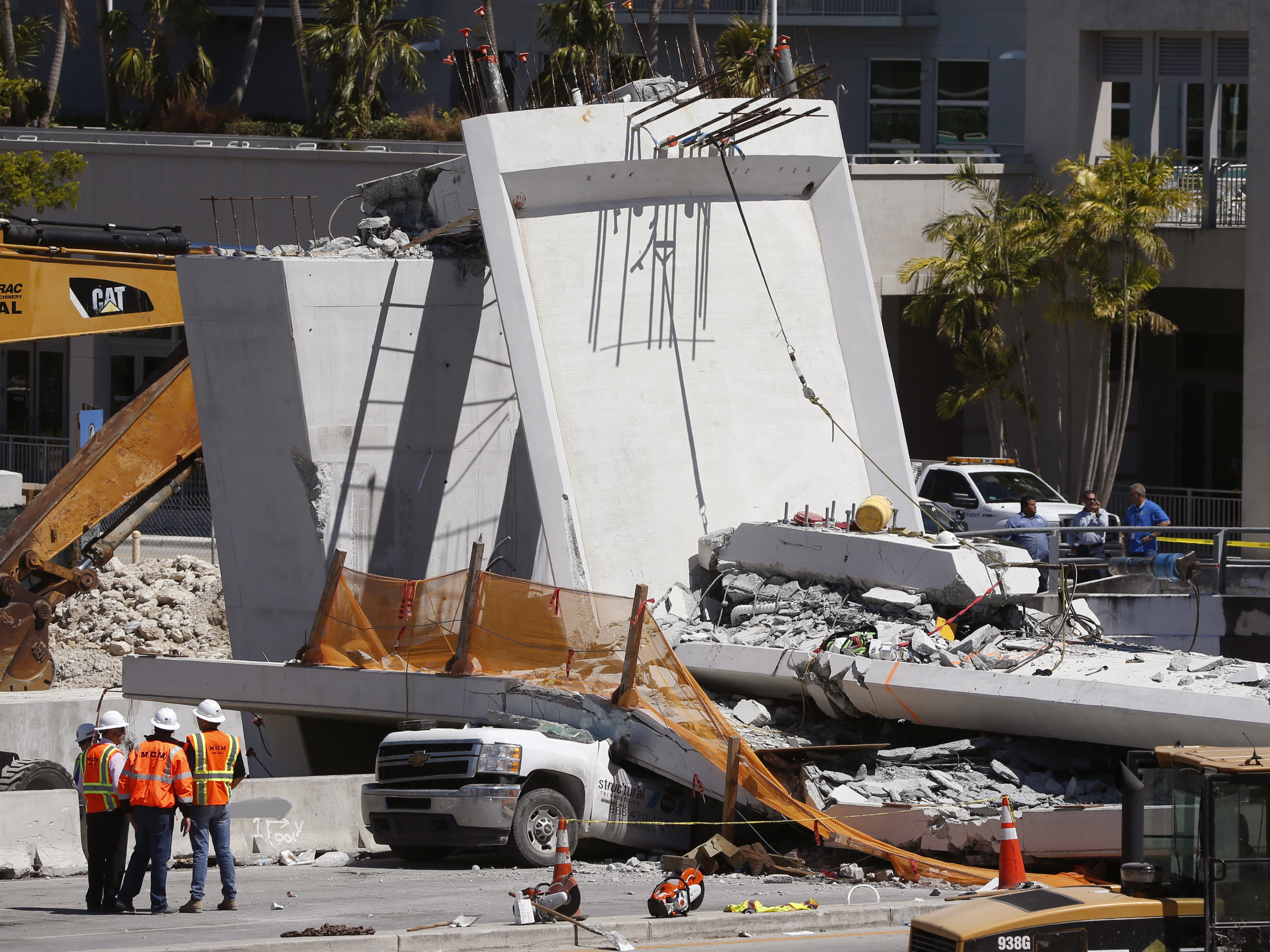 As bodies are pulled from rubble, questions mount about Miami bridge