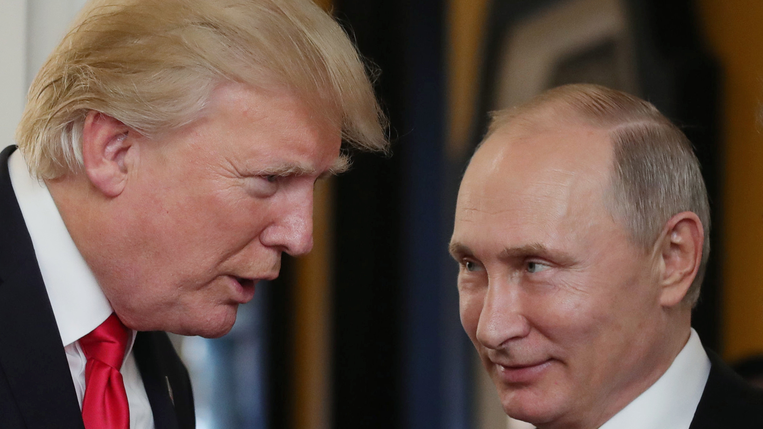 President Donald Trump chats with Russia's President Vladimir Putin as they attend the APEC Economic Leaders' Meeting, part of the Asia-Pacific Economic Cooperation (APEC) leaders' summit in Vietnam on November 11, 2017. (AFP/Getty Images)