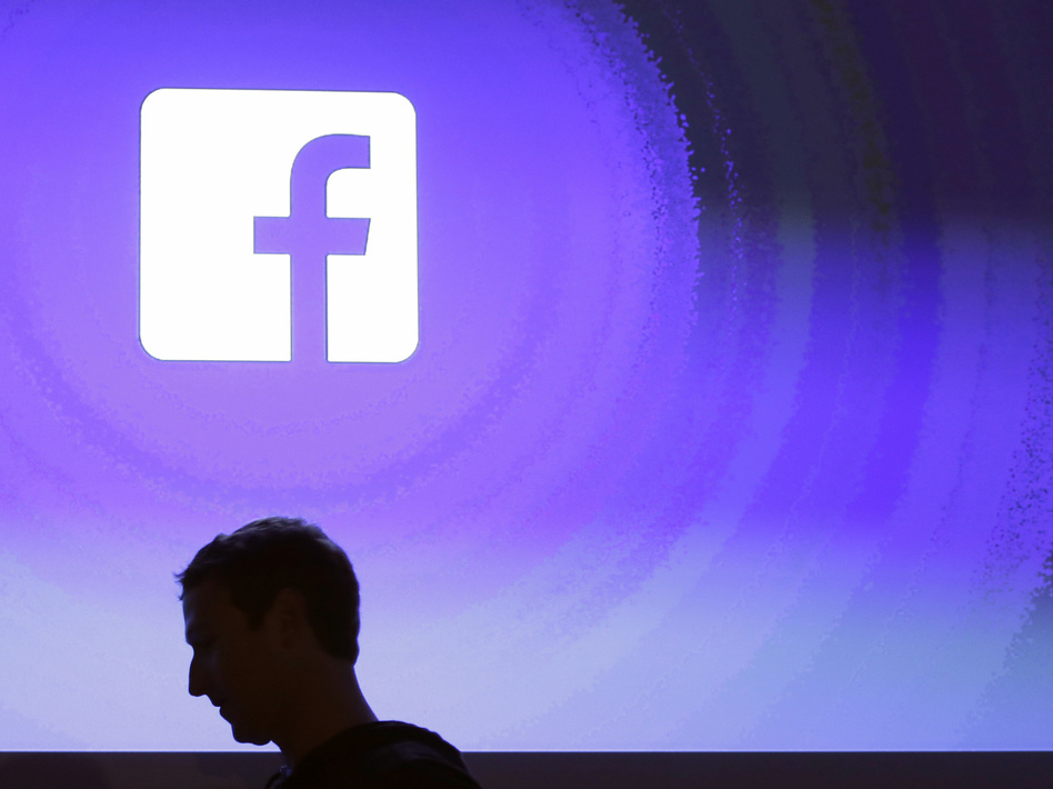 Facebook CEO Mark Zuckerberg walks at the company's headquarters in Menlo Park, Calif., in 2013. NPR asked Americans what steps they take to protect their Facebook data. (Marcio Jose Sanchez/AP)