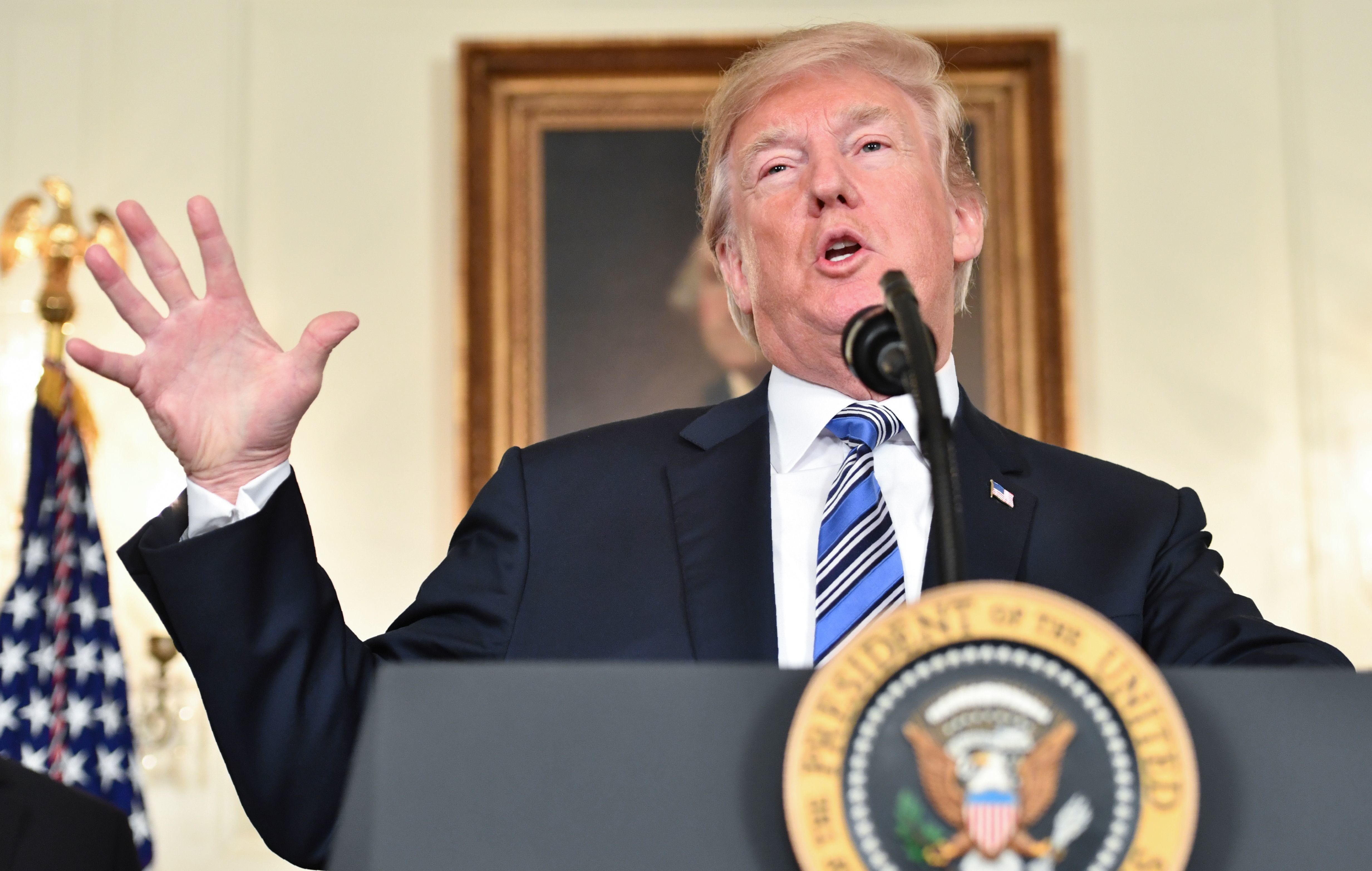 President Trump speaks about the $1.3 trillion spending bill that he signed, despite an earlier veto threat. (AFP/Getty Images)