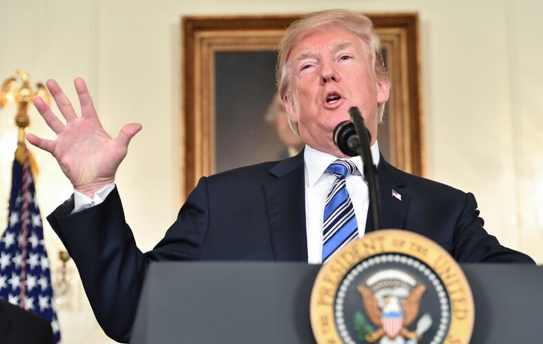 President Trump speaks about the $1.3 trillion spending bill that he signed, despite an earlier veto threat. (Nicholas Kamm/AFP/Getty Images)