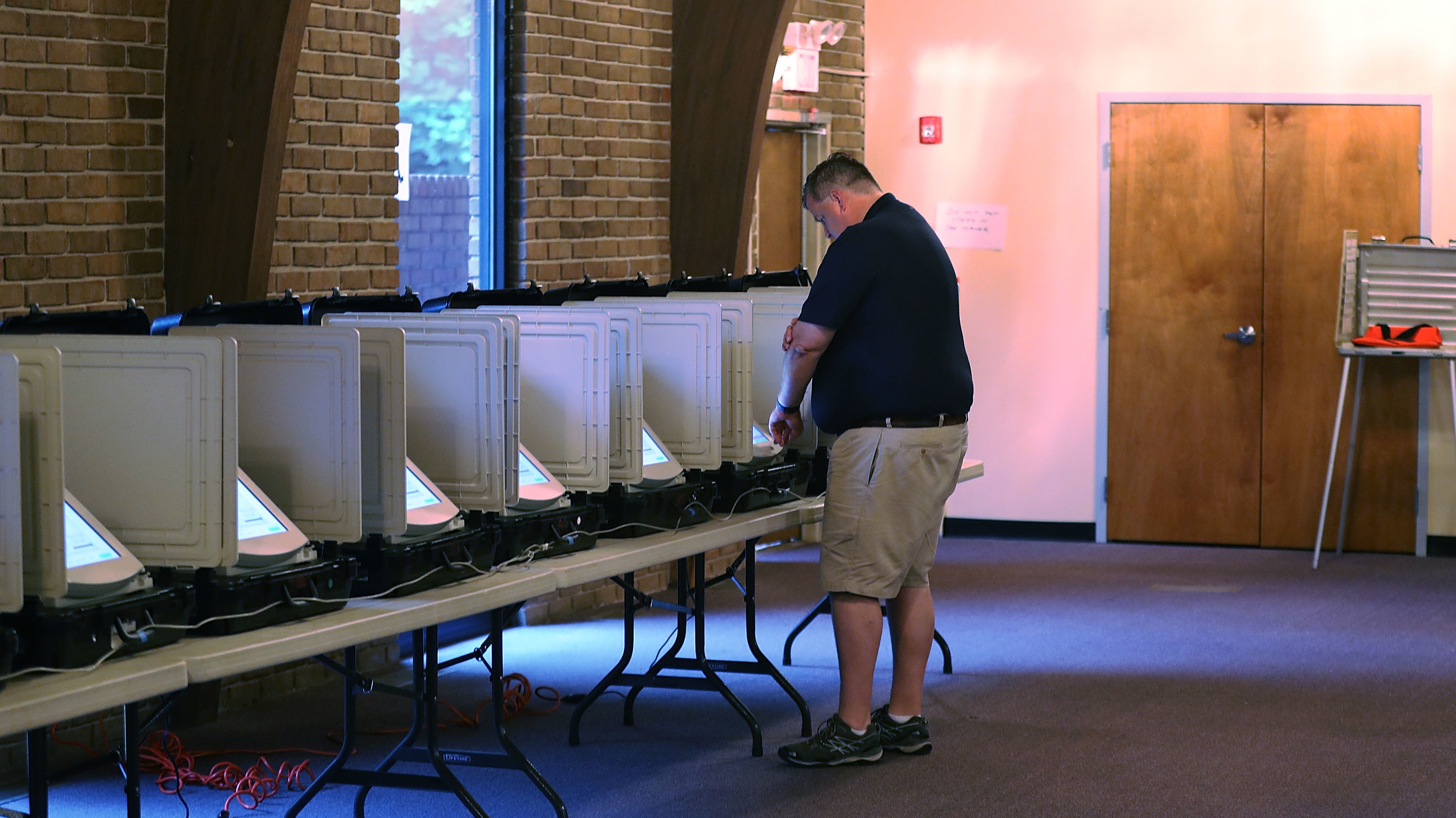 A voter casts his ballot during a special election in Georgia's 6th Congressional District special election last June. Georgia is the largest state that exclusively still uses electronic voting machines that don't leave a paper trail, a major concern for election officials and cybersecurity experts. (Getty Images)