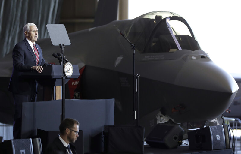 Vice President Mike Pence addresses U.S. military personnel in front of an Air Force F-35 fighter at U.S. Yokota Air Base, on the outskirts of Tokyo, on Feb. 8. The military will be buying an additional 90 F-35s this year, its most modern - and most expensive - fighter jet. (Kiyoshi Ota/AP)