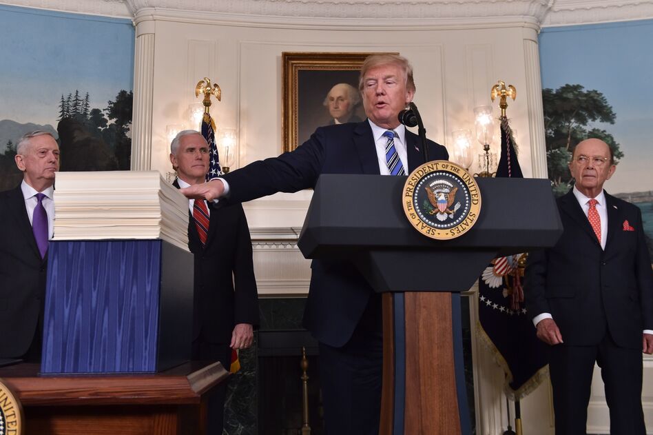 President Trump speaks about the recently passed spending bill at the White House on Friday. Trump threatened to veto the bill before later signing it. (Nicholas Kamm/AFP/Getty Images)