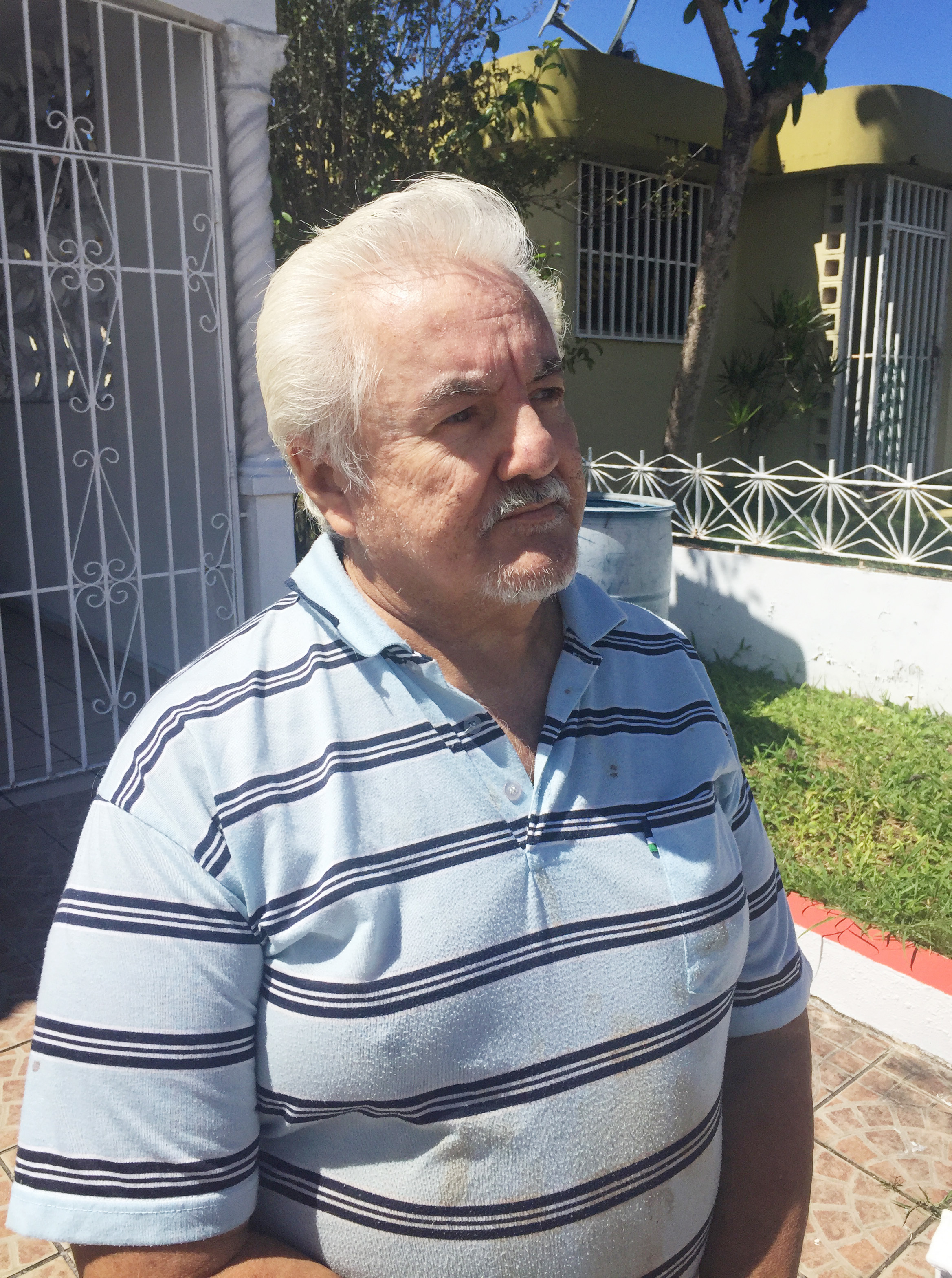 After a lifetime of agricultural work on the U.S. mainland, Ausberto Maldonado retired home to a suburb of San Juan, Puerto Rico. But he has diabetes, and especially since Hurricane Maria, has been struggling to get by. (Sarah Varney/Kaiser Health News)