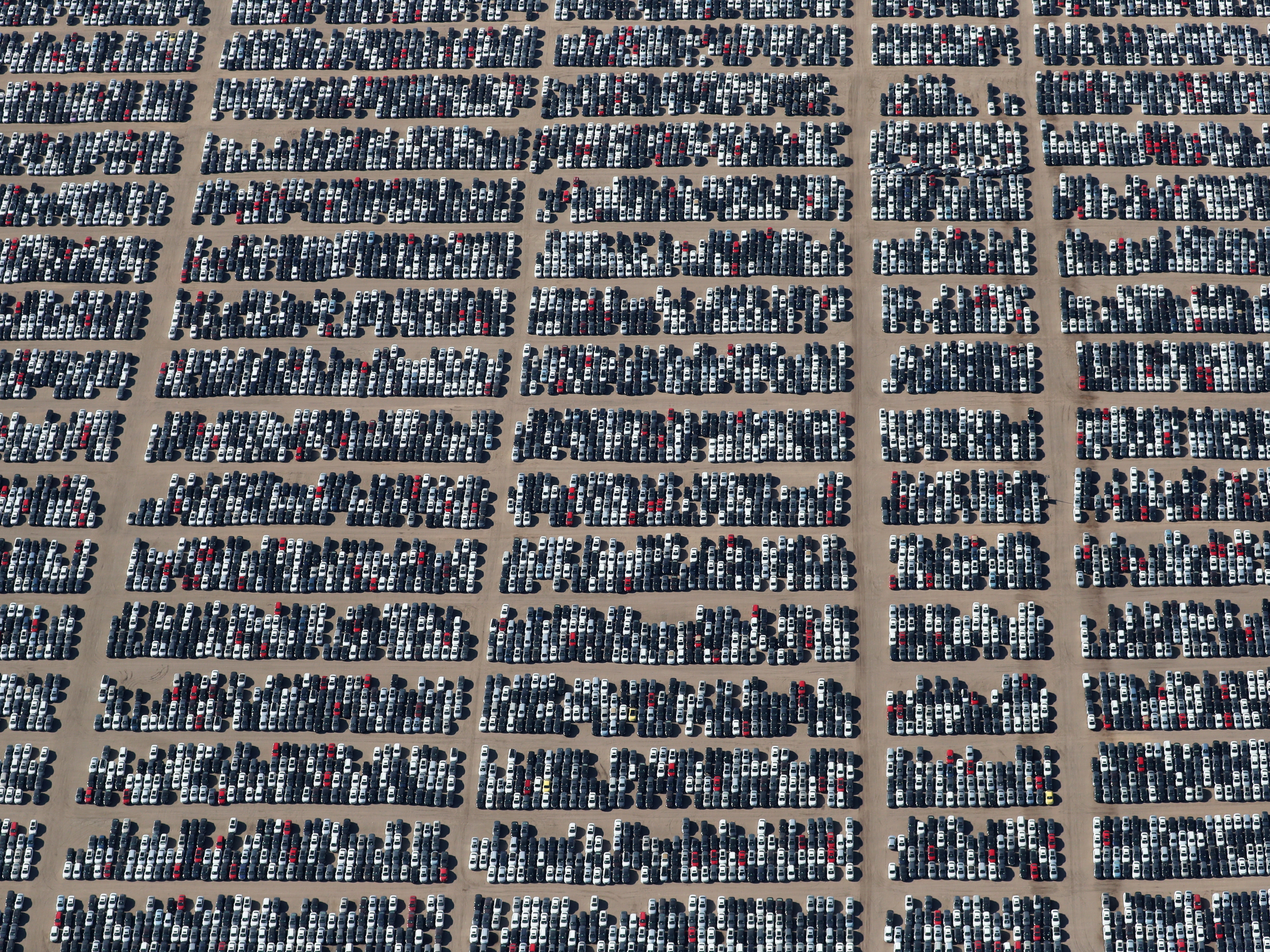 Reacquired Volkswagen and Audi diesel cars sit in a desert graveyard near Victorville, Calif., on Wednesday. Volkswagen AG has paid more than $7.4 billion to buy back about 350,000 vehicles, the automaker said in a recent court filing. (Reuters)