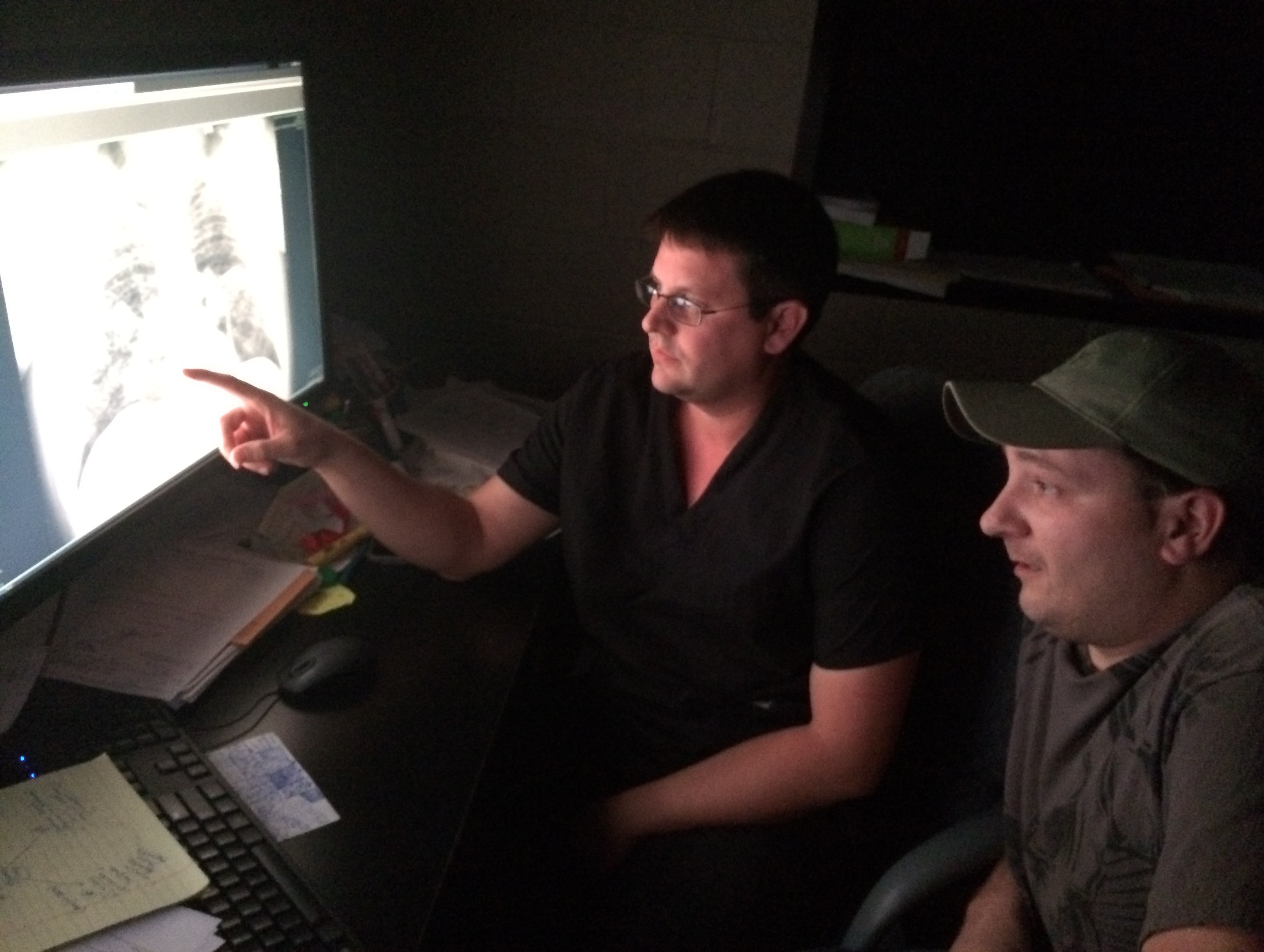 Radiologist Dr. Brandon Crum reviews an X-ray of the lungs of Mackie Branham, who suffers from advanced black lung disease. Dr. Crum is among the Kentucky radiologists now barred from assessing X-rays in state workers' compensation cases filed by coal miners seeking black lung benefits. (NPR)