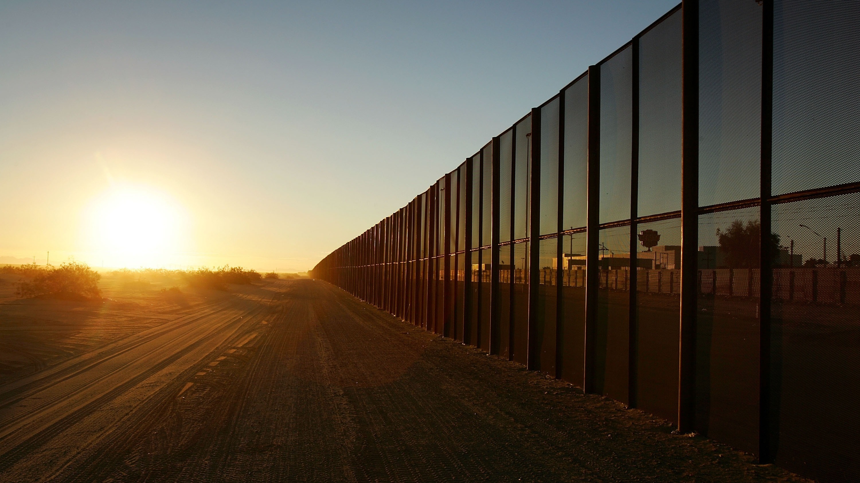 A metal fence runs along the U.S.-Mexico border east of San Luis, Ariz. (Getty Images)