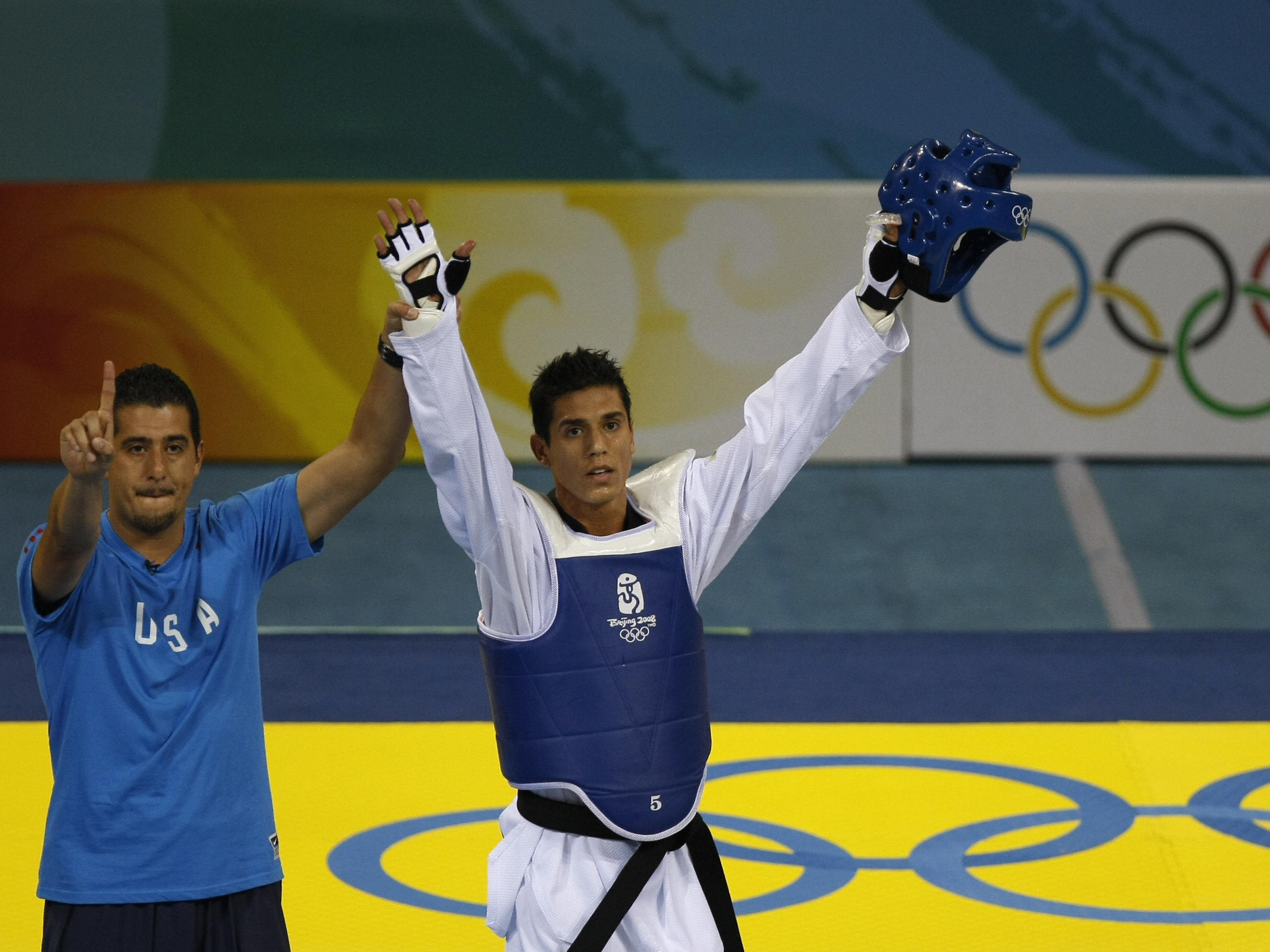U.S. coach Jean Lopez and his brother Steven celebrate after Steven defeated Rashad Ahmadov of Azerbaijan, winning him a bronze medal in the 2008 Beijing Olympic Games. (AFP/Getty Images)