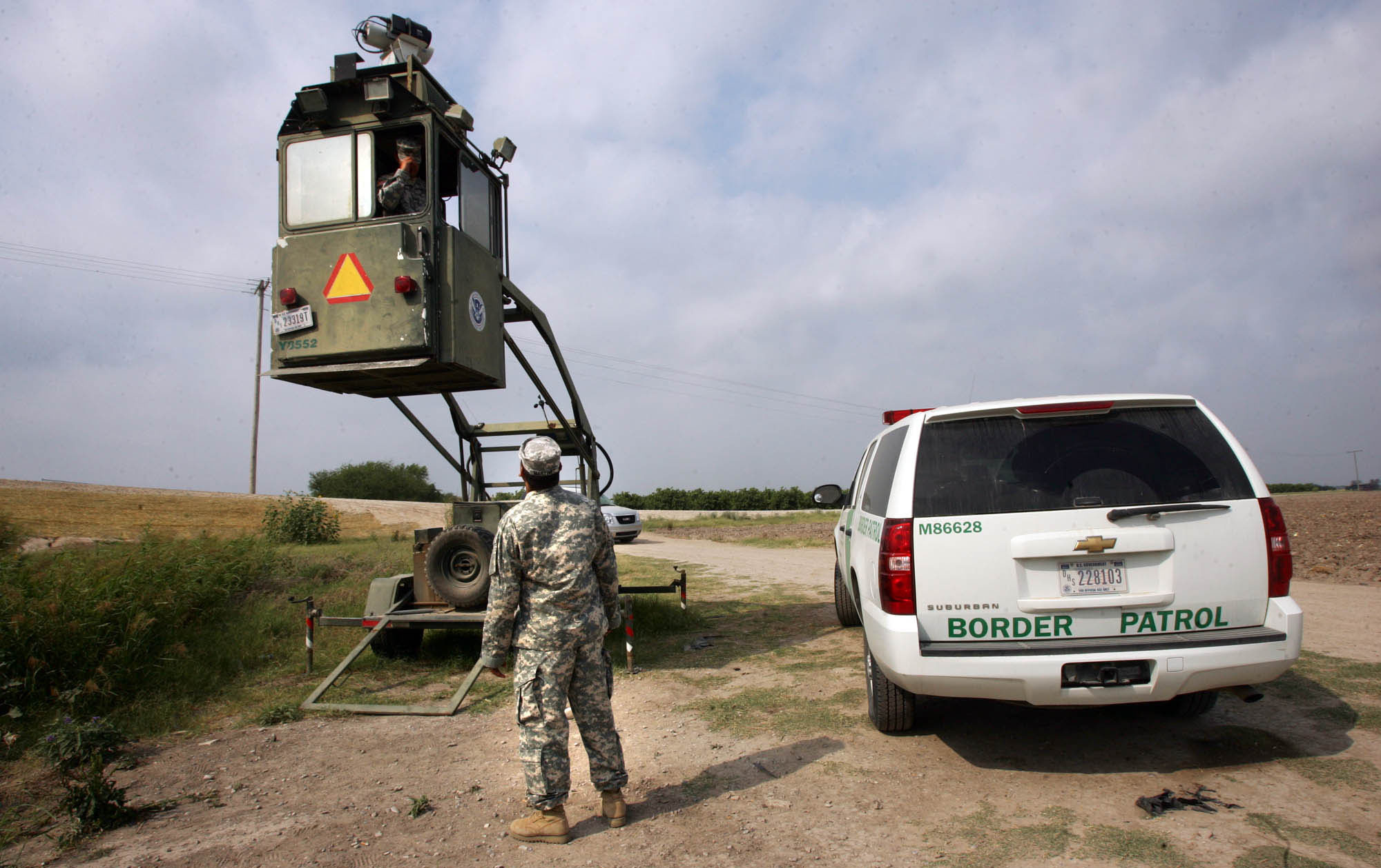 A member of the National Guard checks on his colleague inside a Border Patrol Skybox near the U.S.-Mexico border in Hidalgo, Texas, in 2011. President Trump is calling for troops on the Southern border, something the past five presidents have all done on a limited basis.