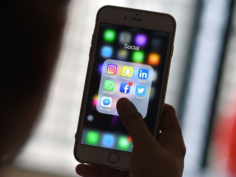 Things like smartphone addiction, false stories and election interference leave some tech executives regretful about what they've created. (Manan Vatsyayana/AFP/Getty Images)