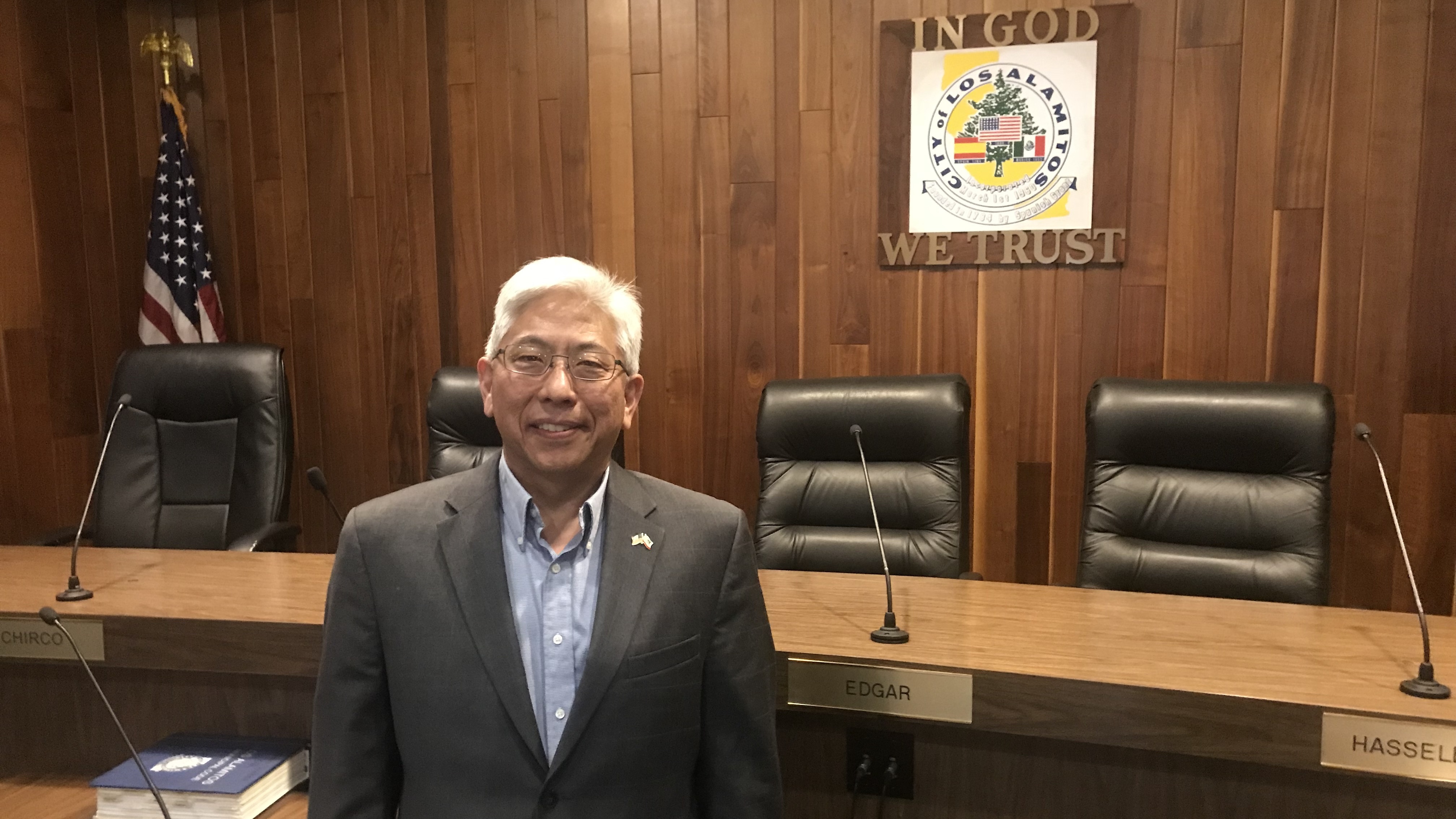 Los Alamitos Mayor Pro Tem Warren Kusumoto argues his small city is caught in the middle of a legal fight between the Trump administration and the state of California. (NPR)