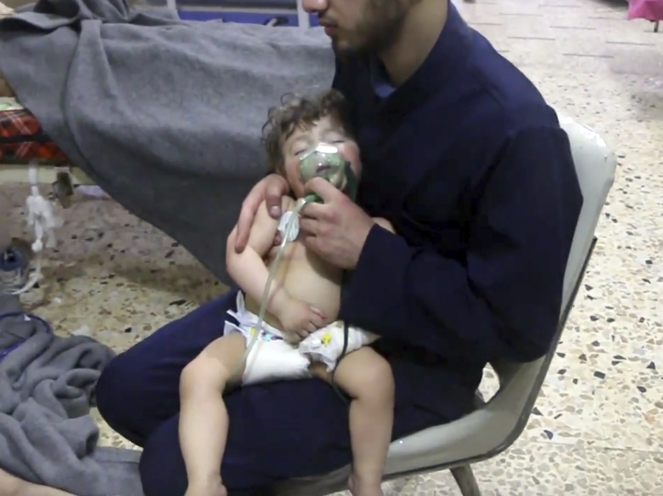 This image made from video shows a medical worker administering oxygen through respirators following an alleged poison gas attack in Douma. The Syrian government denied the allegations. (Syrian Civil Defense White Helmets/AP)