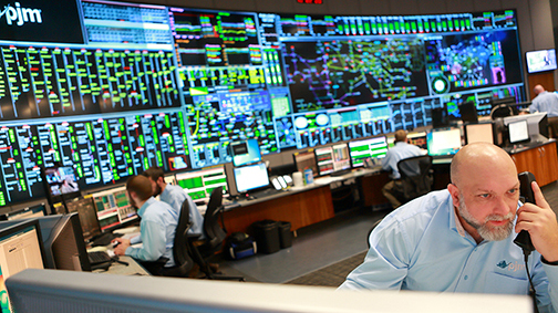 In the control room of PJM Interconnection, employees monitor a power grid that stretches across the Midwest and Mid-Atlantic.